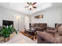 Cozy living room with a plush sofa, modern coffee table, and neutral decor at 7012 Somerset Springs Dr # E, Charlotte, NC 28262