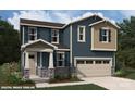 Two-story home with blue siding, stone accents, and a two-car garage at 9864 Quercus Ln, Huntersville, NC 28078