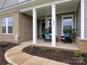 Inviting front porch with stylish seating, perfect for relaxing outdoors at 1005 Willow Bank Ln, Belmont, NC 28012