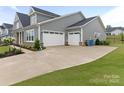Spacious three-car garage and extra wide driveway at 1005 Willow Bank Ln, Belmont, NC 28012