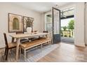 Inviting dining room with a dining table, bench, and access to the backyard at 123 Armstrong Rd, Belmont, NC 28012
