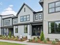 Stylish two-story home with gray siding, dark trim, and inviting landscaping at 123 Armstrong Rd, Belmont, NC 28012