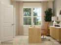 Well-lit home office featuring a modern desk setup with a window view and neutral tones at 1569 Croydon St, Indian Land, SC 29707
