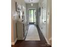 Inviting foyer with hardwood floors, a decorative console table, and a view of the front door at 1673 Beleek Ridge Ln, Clover, SC 29710
