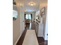 Welcoming entryway with dark wood floors, decorative furnishings, and staircase at 1673 Beleek Ridge Ln, Clover, SC 29710
