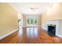 Bright living room with hardwood floors, fireplace, access to the backyard, and neutral walls at 2019 Steeplechase Dr, Rock Hill, SC 29732