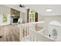 View of the living room, with vaulted ceilings, a beautiful fireplace and large windows at 3124 5Th Street Ne Pl, Hickory, NC 28601