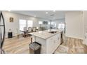 Open kitchen featuring a large island with seating and easy access to the dining and living areas at 322 Olympia Way, York, SC 29745