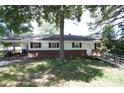 Ranch-style home exterior with ramp and a mix of brick and siding ready for a new owner at 402 Villa St, Kannapolis, NC 28083