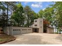 Exterior view of gray home with multi-car garage and concrete driveway at 5075 Lakeview Cir, Sherrills Ford, NC 28673