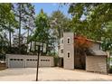 Gray home exterior with a multi-car garage, concrete driveway and basketball hoop at 5075 Lakeview Cir, Sherrills Ford, NC 28673