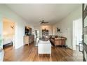 Inviting living room with hardwood floors, stylish decor, and ample natural light, creates a cozy atmosphere at 7901 Bud Henderson Rd, Huntersville, NC 28078