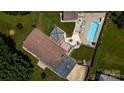 Aerial view showcases a large backyard with a pool, gazebo, and outdoor entertaining space at 920 Thomas St, Statesville, NC 28677