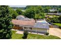 Aerial view of home showing the backyard, neighboring properties, and swimming pool at 920 Thomas St, Statesville, NC 28677