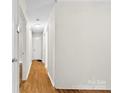 Hallway featuring hardwood floors and doors leading to other rooms in the home at 1156 Westover Cir, Rock Hill, SC 29732