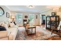 Cozy living room featuring hardwood floors, a stylish rug, and natural light from two large windows at 1175 18Th Ne Ave, Hickory, NC 28601