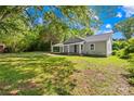 Lovely one-story home with a covered porch surrounded by a spacious, well-maintained lawn at 1528 Avondale Dr, Statesville, NC 28625