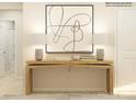 Bright hallway features decorative console table with lamps and abstract art, creating a welcoming and stylish entrance at 1554 River Cane St, Edgemoor, SC 29712