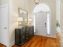 Elegant foyer featuring hardwood floors, a decorative mirror, and a chandelier at 1653 Shetland Ln, Rock Hill, SC 29730