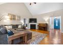 Inviting living room with vaulted ceilings, cozy fireplace, and a comfortable sectional sofa at 179 Browning Dr, Taylorsville, NC 28681