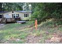 Single-story house features a charming front porch, creating a welcoming and cozy atmosphere at 226 Lake Sylvia Rd, Lincolnton, NC 28092