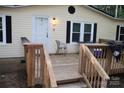 Cozy front porch with seating, offering a welcoming entrance to this home at 226 Lake Sylvia Rd, Lincolnton, NC 28092
