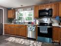 Well-equipped kitchen with stainless steel appliances and ample counter space at 226 Lake Sylvia Rd, Lincolnton, NC 28092