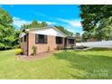 Single Gathering house with front yard and mature landscaping at 2323 Brookwood Rd, Lincolnton, NC 28092
