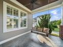 Relaxing porch featuring a swing and a ceiling fan with an inviting outdoor ambiance at 3007 Arsdale Rd, Waxhaw, NC 28173