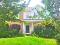 Two-story house with brick and vinyl exterior, well-manicured lawn at 3509 Joel Turner Dr, Charlotte, NC 28216