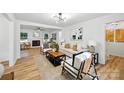 Bright living room with modern decor, hardwood floors, fireplace and an open floor plan at 6127 Eagle Peak Dr, Charlotte, NC 28214
