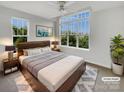 Serene bedroom with a king bed, large window, and modern decor, offering a peaceful retreat at 7130 Founders Club Ct, Charlotte, NC 28269