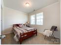 Comfortable bedroom featuring natural light, neutral paint, and a carpeted floor at 1211 Calder Dr, Indian Trail, NC 28079