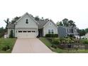 Beautiful exterior of home with well maintained lawn and driveway that leads to a 2 car garage at 15250 Windward Ln, Lancaster, SC 29720