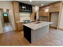 Beautiful open concept kitchen with custom cabinetry, granite countertops, and hardwood flooring at 1721 S New Hope Rd, Gastonia, NC 28054