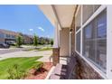 Inviting covered front porch with stone accents and view of the neighborhood street at 2527 Linhay Dr, Charlotte, NC 28216