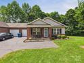 Attractive townhome with brick accents, a single-car garage, and a neatly landscaped front yard at 2541 26Th Ne Ave, Hickory, NC 28601