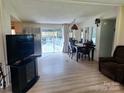 Open dining area with sliding glass doors to the outdoor patio at 5022 Wrenn Dr, Denver, NC 28037