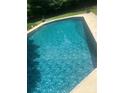 Close-up of a clear, inviting in-ground swimming pool at 6313 Weddington Rd, Concord, NC 28027