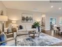 Comfortable living room featuring a neutral color palette, stylish decor, and wood flooring at 8473 Norman Forest Rd, Lancaster, SC 29720