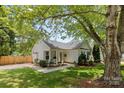 Attractive home with manicured front lawn, inviting porch seating, and a neatly edged walkway at 10621 Glenmac Rd, Charlotte, NC 28215