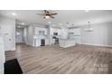 The open floor plan seamlessly connects the living area to the gourmet kitchen at 12526 Susanna Dr, Charlotte, NC 28214