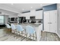 Modern kitchen with stainless appliances, granite countertops, stylish island with seating at 1723 Town Oak Ln, Charlotte, NC 28205