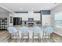 Modern kitchen with stainless appliances, granite countertops, stylish island with seating at 1723 Town Oak Ln, Charlotte, NC 28205