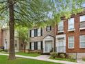 Lovely townhome with brick exterior, black shutters and lush landscaping at 181 Singleton Rd, Mooresville, NC 28117