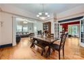 Open dining room boasts stylish chandelier and gorgeous wood floors at 200 W 14Th St, Salisbury, NC 28144