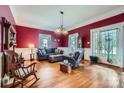 Inviting living room featuring hardwood floors, ample seating, and a lovely fireplace at 200 W 14Th St, Salisbury, NC 28144