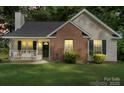 Charming one story home featuring a brick facade, covered front porch and well maintained lawn at 209 Mcfadden St, Rock Hill, SC 29730
