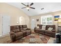 Spacious living room with high ceilings, ceiling fan, neutral colors, and carpeted flooring at 209 Mcfadden St, Rock Hill, SC 29730