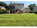 The backyard features a screened-in porch and wooden stairs at 228 31St Avenue Ne Ct, Hickory, NC 28601